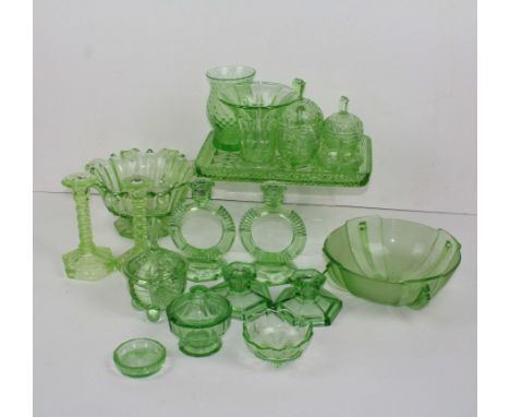 A collection of Art Deco moulded green glass dressing table and serving wares, includes candlesticks, salad bowls, vases and 