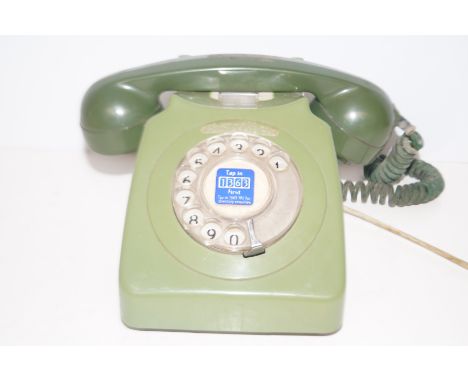 Vintage dial telephone in green