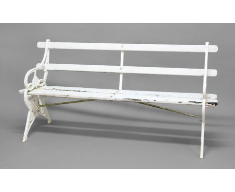 VICTORIAN STYLE GARDEN BENCH, possibly Coalbrookdale, the cast iron ends with stylised leaves and art nouveau style swirling,
