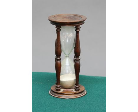 MAHOGANY FRAMED SAND TIMER, earlier 20th century, with double baluster turned supports, height 16cm