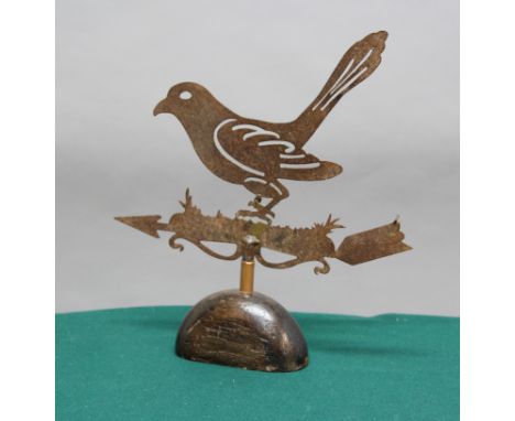 FOLK ART: weather vane in the form of a bird, late 19th or 20th century, on a domed oak mount, length 35cm