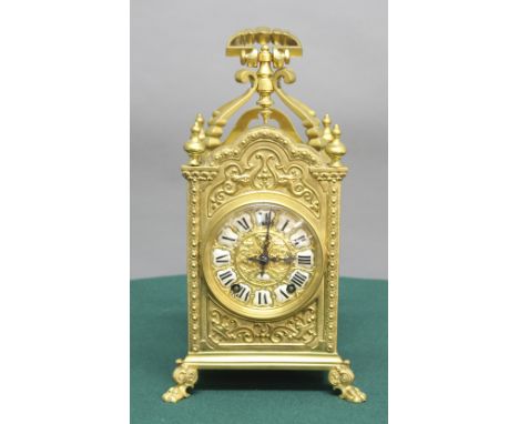 FRENCH BRASS MANTEL CLOCK, the gilt dial with enamelled numerals on a brass, eight day movement half hourly striking to a gon