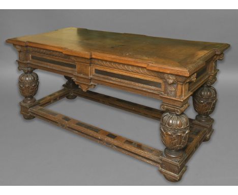 OAK CENTRE TABLE, 18th century, perhaps Flemish, the top with breakfront sides above a carved frieze on cup and cover legs ti