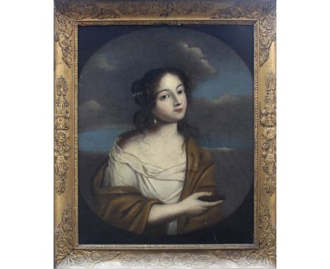 MANNER OF GIOVANNI MARTINELLI (1600-1659) LADY WITH A PRAYER BOOK Oil on canvas, within a painted oval 72 x 57cm. ++ Lined; r