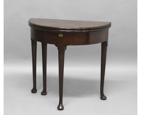 GEORGE II MAHOGANY DEMI LUNE CARD TABLE, the double folding top enclosing a storage well, on pad feet, height 73cm, width 76c