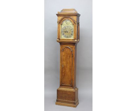 OAK LONGCASE CLOCK, the brass dial with 11 1/4" silvered chapter ring, subsidiary seconds dial and date aperture, the arch in