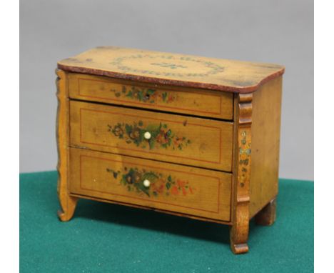 SCANDINAVIAN STYLE PAINTED BIRCH MINIATURE COMMODE, 19th century, with three long drawers and painted floral decoration, heig