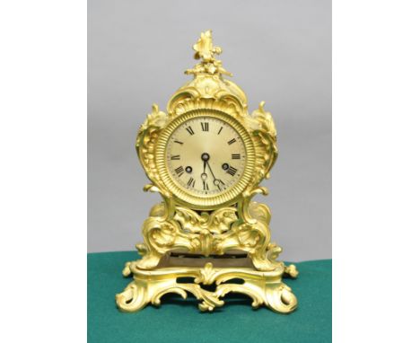 FRENCH ORMOLU MANTEL CLOCK, 19th century, the 3 3/4" silvered dial on a brass, eight day movement striking half hourly to a b