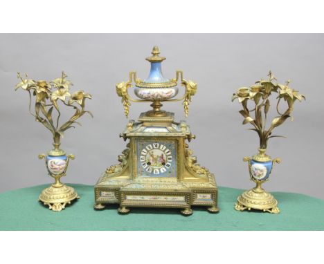 FRENCH GILT METAL AND PORCELAIN MOUNTED MANTEL CLOCK, by Japy Freres, late 19th century, the 10cm porcelain dial on a brass, 