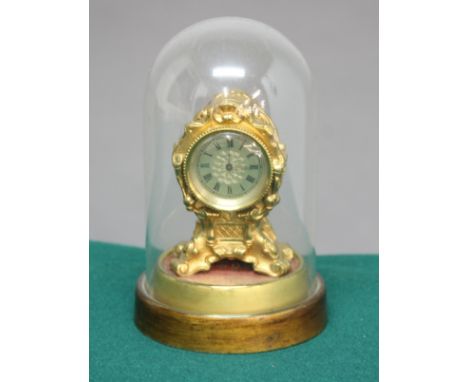 GILT METAL MANTEL CLOCK, the 1 1/2" silvered dial on a fob watch movement inscribed James Wightman, London, the case with scr