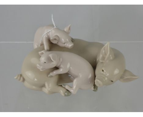 A Porcelain Lladro Figure of a Sow and Piglets. 