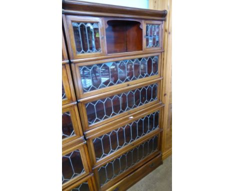 A Globe-Wernicke Co Ltd., Stacking Book Cases, the mahogany inlaid case having astral glazed doors and five stacking shelves.