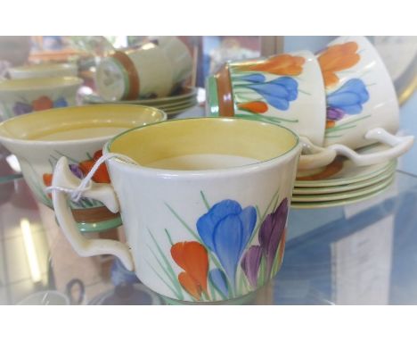 Clarice Cliff 'Crocus' Pattern Tea Set, comprising three cups, four saucers and a sugar bowl. (8)