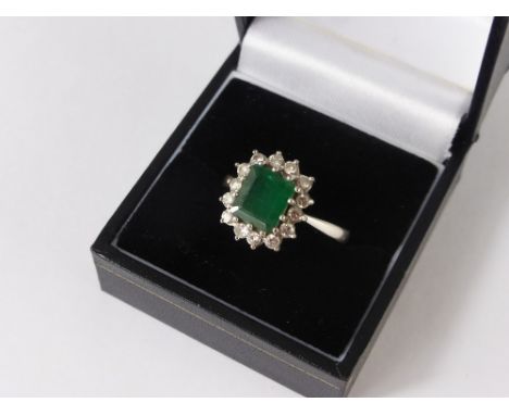 A Lady's 18 ct White Gold Diamond and Square Cut Emerald Ring, size R, approx  wt 5 .6 gms., dias 56 pts, 14 x 4 pts, emerald