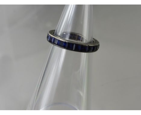 A Lady's 9 ct White Gold and Sapphire Eternity Ring, size L, approx wt 8 gms. 