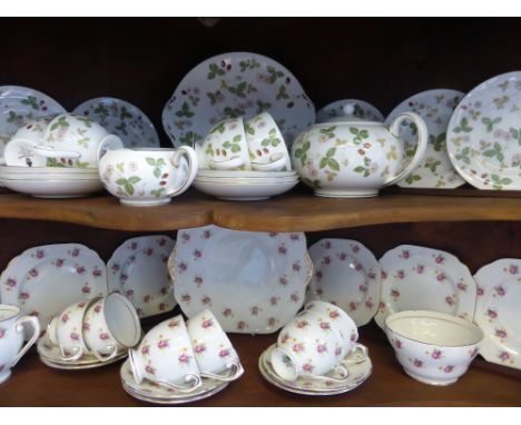 A Part Wedgwood Wild Strawberry Tea Set, comprising tea pot, milk jug, sugar bowl, six cups, six saucers, six sandwich plates