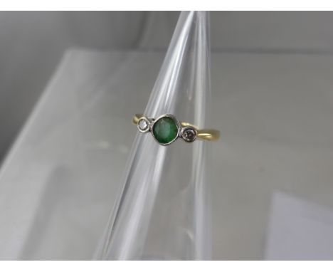 A Lady's 18 ct Diamond and Emerald Ring, size I, approx wt 1.9 gms. 