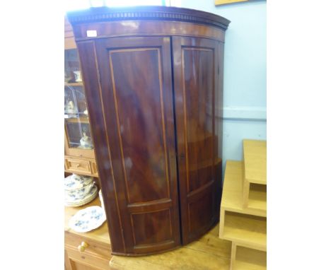 An Antique Mahogany and Satin Wood Inlay Three Shelf Corner Cabinet. The cabinet having key style decorative pelmet to top, a