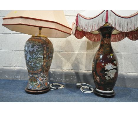 A PAIR OF 20TH CENTURY ORIENTAL CERAMIC TABLE LAMPS, with large fabric shades, height to fitting 64cm and 72cm