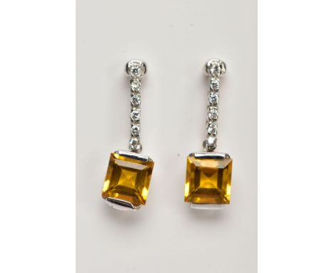 A PAIR OF WHITE METAL EARRINGS, drop earrings set with a row of colourless stones, suspending a square cut yellow stone, stam