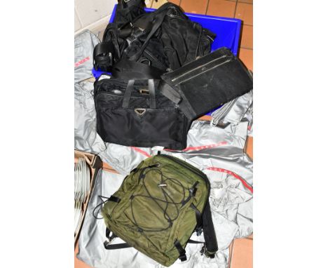 SEVEN USED / MOULD DAMAGED PRADA RUCKSACKS/ COMPUTER BAGS/ HOLDALL, together with eleven fabric drawstring Prada dust bags in