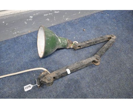 AN INDUSTRIAL ANGLED DESK LAMP, possibly made my Met-Elek, with a green enamel shade (distressed condition)