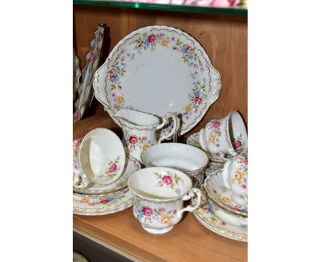 A ROYAL ALBERT JUBILEE ROSE PATTERN NINETEEN PIECE TEA SET, comprising a bread and butter plate (second), a milk jug (second)