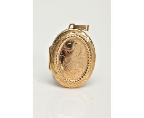 A 9CT GOLD OVAL LOCKET PENDANT, foliage engraved design to the front and a plain polished reverse, hallmarked 9ct Birmingham,