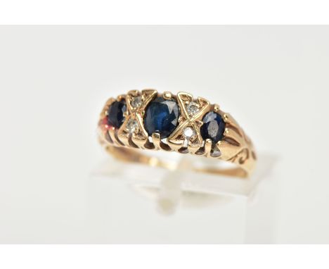 A LATE 20TH CENTURY SAPPHIRE AND DIAMOND BOAT RING, centring on an oval cut deep blue sapphire interspaced with four small ro