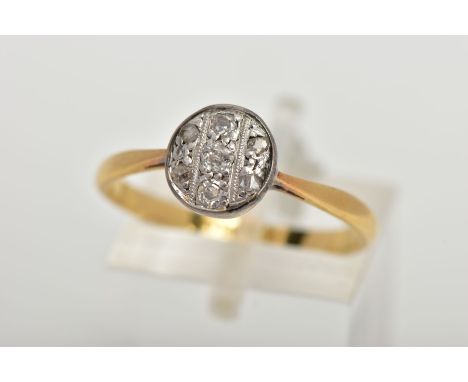 A YELLOW METAL DIAMOND RING, the ring head of a circular design set with three old cut diamonds and four rose cut diamonds, w