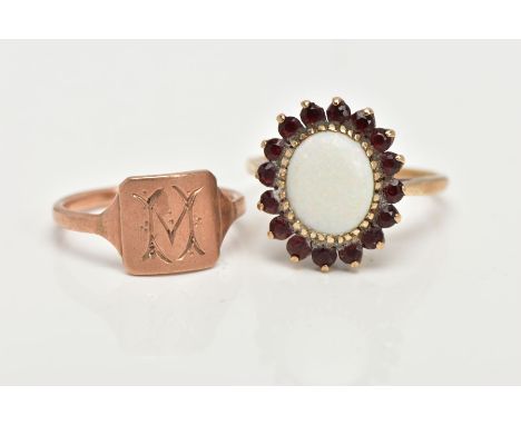 A 9CT GOLD OPAL DRESS RING AND A ROSE METAL SIGNET, an oval opal set with sixteen circular cut garnets, prong set in yellow g