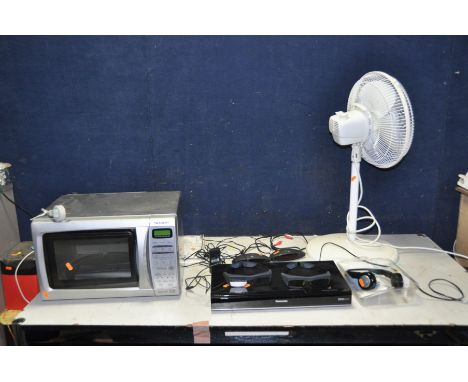 A PANASONIC DMR-HW120 HARD DISC FREEVIEW RECORDER, a Sharp Microwave, two Sony TMR-IF 130 wireless stereo transmitters and a 