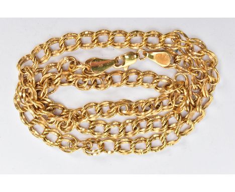 A YELLOW METAL FANCY LINK CHAIN, double circular link chain fitted with a lobster clasp, stamped 9k, length 440mm, approximat