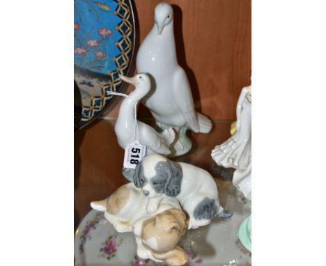 THREE NAO ORNAMENTS, comprising a pigeon, height 21cm, a duck, height 14.5cm and a group of two puppies (3) (Condition report