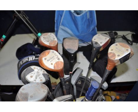 A SELECTION OF GOLFING EQUIPMENT to include two golf bags containing various clubs, a manual/push along golf cart, a Hillbill