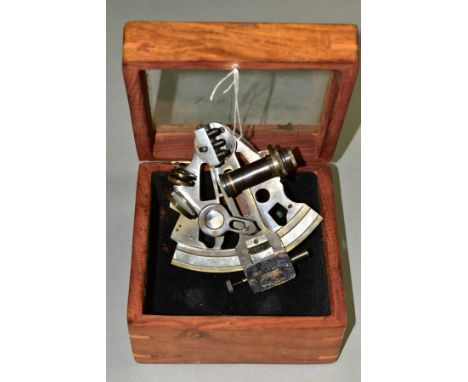 A KELVIN &amp; HUGHES NAUTICAL SEXTANT DATED 1917, together with a wooden stowage box with an etched glass lid, the sextant i