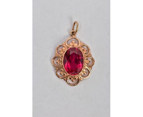 A YELLOW METAL SYNTHETIC RUBY PENDANT, designed with a central oval cut synthetic ruby, approximate dimensions length 14.4mm 