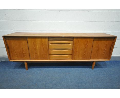 A MID CENTURY DANISH TEAK SIDEBOARD, possibly 'Dyrlund' that's inspired by Arne Vodder's Triennale range, with two duel slidi