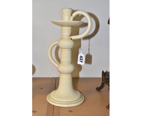 A WILEMAN &amp; CO FOLEY FAIENCE ART POTTERY CANDLESTICK IN A CREAM 'SPANO-LUSTRA' GLAZE, with two scrolled handles on a turn
