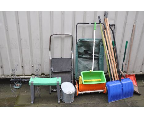 A SELECTION OF GARDEN TOOLS including a lawn sweeper, a lawn seeder, a set of steps etc