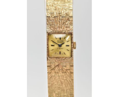 A LADIES 9CT GOLD 'DELVINA' WRISTWATCH, hand wound movement, square gold dial signed 'Delvina, Geneve, 17 jewels', baton mark