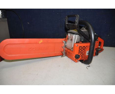 A DOLMAR CHAINSAW model No 115i (engine pulling freely) along with an Outdoor revolution tent (unassembled) (2)