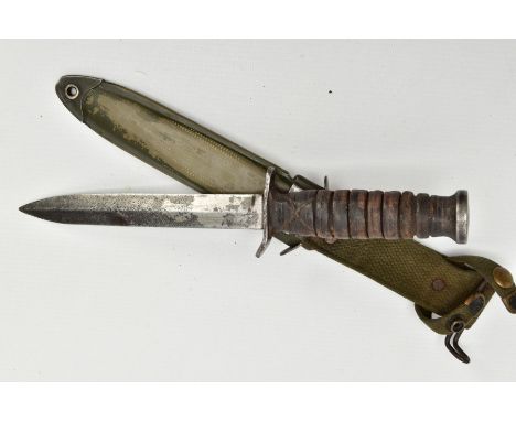 AMERICAN WORLD WAR TWO ERA M3 FIGHTING KNIFE, in metal and canvas scabbard, the knife cross guard is marked 'US-M3-Utica', ma