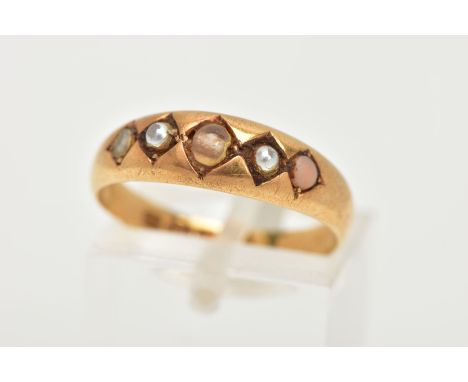 A LATE VICTORIAN 18CT GOLD RING, designed with four seed pearls and a central colourless bead (damage and replacements) to a 