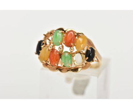 AN AF YELLOW METAL GEM SET RING, (missing two stones), set with eight other oval cabochons assessed as dyed jade, each claw s