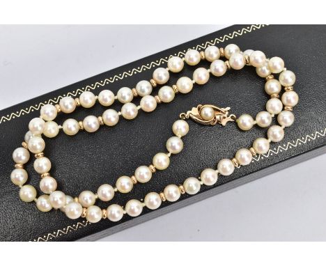 A CULTURED PEARL NECKLACE, a single row strand, each pearl measuring approximately 6mm, interspaced with yellow gold beads, f
