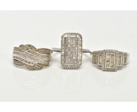 THREE WHITE METAL DIAMOND SET DRESS RINGS, large dress rings, each set with single cut and tapered baguette cut diamonds, eac