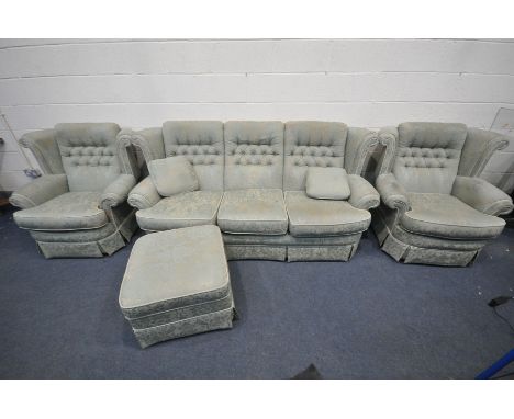 A FLORAL GREEN UPHOLSTERED LOUNGE SUITE, comprising a three seater sofa, pair of armchairs and a pouffe (4) (condition:-some 