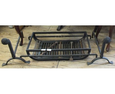 A pair of iron fire dogs and fire grate