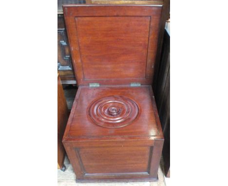 A large 19th Century mahogany commode with fitted interior and blue and white bowl